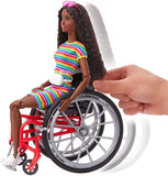 Barbie Fashionistas Doll #166, with Wheelchair & Crimped Brunette Hair Wearing Rainbow-Striped Dress, White Sneakers, Sunglasses & Fanny Pack, Toy for Kids 3 to 8 Years Old